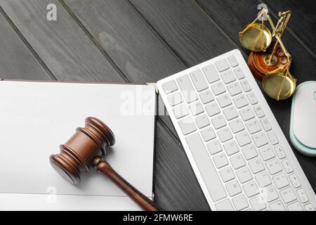 Composition with judge's gavel and keyboard on dark wooden background Stock Photo