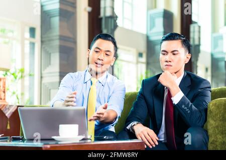 Asian Businessmen having a meeting Stock Photo