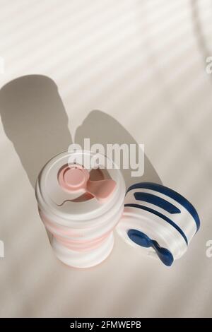 Stylish reusable eco coffee cup on white background. Ban single use plastic. Zero waste concept. Sustainable lifestyle Stock Photo