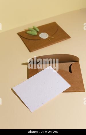 Brown Envelope with empty letter for yur text on beige background Stock Photo