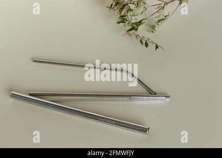 three steel silver reusable straws isolated on white background. Replacing plastic, alternative. Concept zero waste. Stock Photo