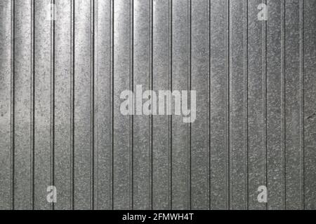 Galvanized stainless steel corrugated plate as background, industrial textures and patterns Stock Photo