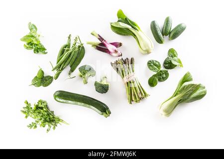 Assorment of fresh green vegetables isolated on white background. Stock Photo