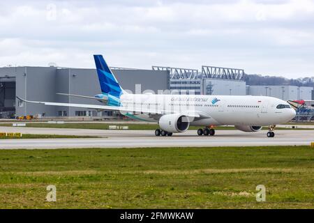 Hamburg, Germany - April 21, 2021: Garuda Indonesia Airbus A330-900neo airplane at Hamburg Finkenwerder airport (XFW) in Germany. Stock Photo
