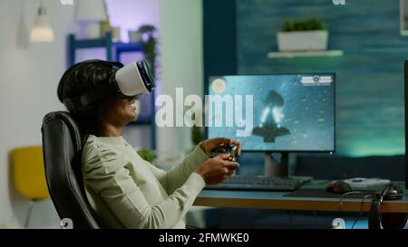 Pro woman egame cyber playing online with virtual reality headset and  wireless controller. Virtual space shooter championship in cyberspace,  esports player performing on pc during gaming tournament Stock Photo - Alamy