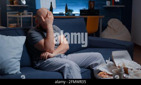 Confused frustrated nevous man breaking letter, debt notification, bad financial report, money problem, eviction notice. Shocked, worried tenant reading warning document for unpaid bank bills Stock Photo