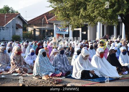 Majalengka, West Java, Indonesia - July 31, 2020 : Indonesian Muslims attend Eid Al-Adha prayers in a yard at a local mosque Stock Photo
