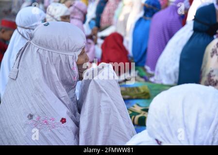 Majalengka, West Java, Indonesia - July 31, 2020 : Indonesian muslims woman pray in Eid Al-Adha prayers in a yard at a local mosque Stock Photo