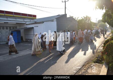 Majalengka, West Java, Indonesia - July 31, 2020 : Indonesian Muslims going back to their home after attend Eid Prayer at local mosque Stock Photo