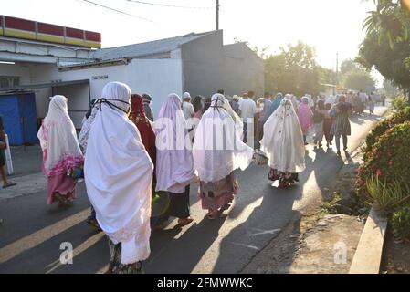 Majalengka, West Java, Indonesia - July 31, 2020 : Indonesian Muslims back to their home after attend Eid Prayer at local mosque Stock Photo