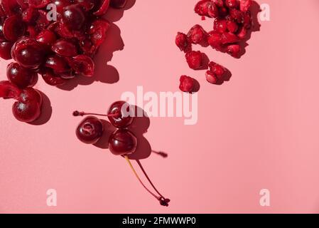 peeled ripe pitted cherries. pink background Stock Photo - Alamy