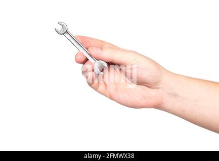 Man holding an open-end wrench for repairs on a white background, isolate. Close-up Stock Photo