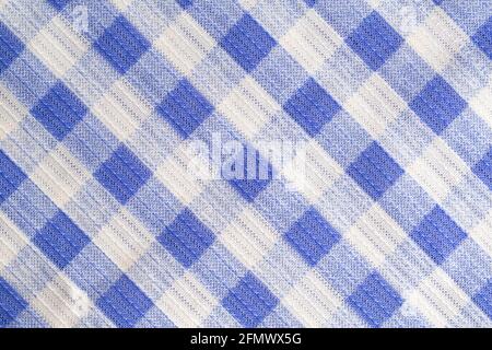 Blue kitchen material in a cage, tablecloth on the table, background. Macro, textured Stock Photo