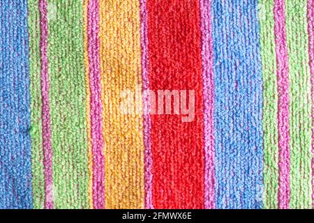 Multi-colored terry towel with stripes, background, macro. Stock Photo