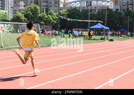 High school student competes in the school track and field day in Shanghai, China Stock Photo