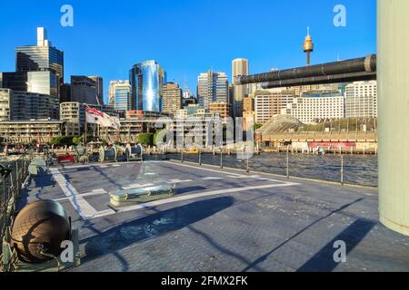 The skyline of Sydney, Australia, seen from the back of the destroyer HMAS Vampire, a museum ship in Darling Harbour Stock Photo