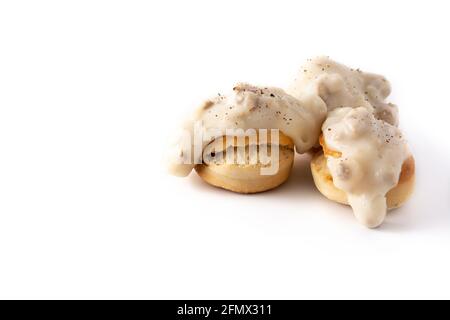 Traditional American biscuits and gravy for breakfast isolated on white background Stock Photo