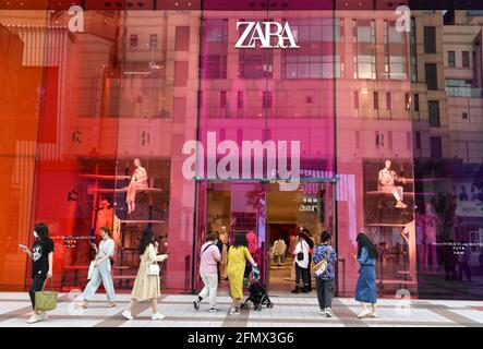 Beijing, China. 10th May, 2021. People walk into the Zara shop on Wangfujing Street in Beijing. Recently, Zara's affiliated company in China was punished by the market supervision and Administration Bureau of Jing'an District, Shanghai, China, for producing and selling unqualified products. Credit: SOPA Images Limited/Alamy Live News Stock Photo