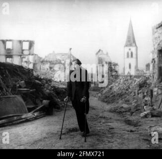 postwar period, misery / adversity, invalid among ruins, probably in Munich, Germany, 1940s, EDITORIAL-USE-ONLY Stock Photo