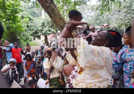Osun Osogbo: Osun Priestesses initiating the children into Osun traditional religion. Stock Photo