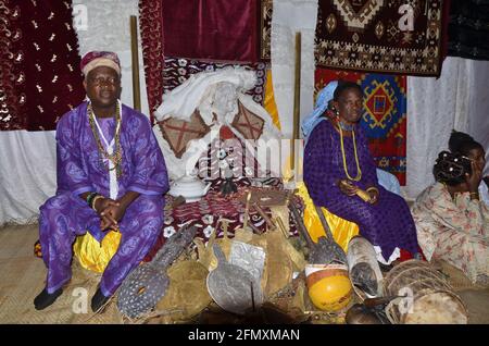 Osun Osogbo Shrine: Baba Osun and Iya Osun sitting beside Osun. Stock Photo