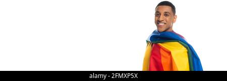 young african american man, covered with lgbt flag, smiling at camera isolated on white, banner Stock Photo