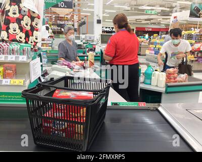 Bangkok, Thailand - August 31, 2020: Asian senior woman wearing face mask in a grocery store during the Coronavirus outbreak. Wang Thonglang. Stock Photo