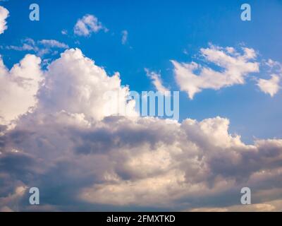 Massive clouds - Cumulus congestus or towering cumulus - on the blue sky Stock Photo