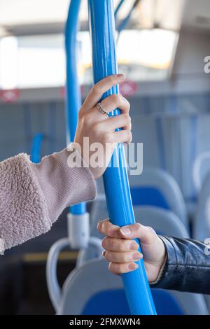 Public transport hands, safety handle and railing loop on bus, train ...