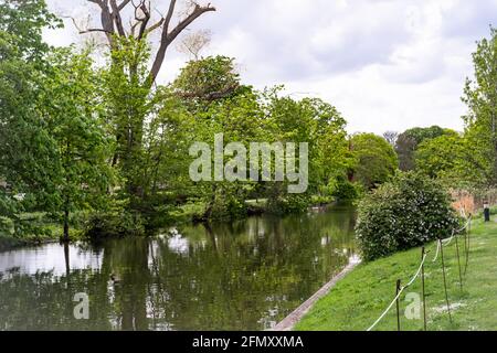 A view along the River Wensum captured from the public footpath beside the river in the centre of Norwich, Norfolk Stock Photo