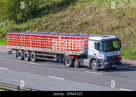 Calor Gas Propane cyclinders; Gases in transport, carriageway, UK hauliers, trailer, trucks, Mercedes Benz lorry, motorway commercials, transportation on the M61 UK Stock Photo