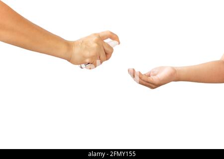 Asian mother spraying sanitizer on Son's Hands isolated in clipping path. Stock Photo