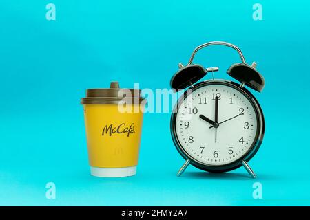 Morning red alarm clock and disposable paper cup or mug isolated on white with clipping path Stock Photo