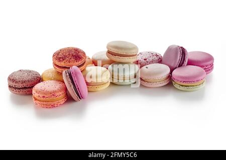 Pile of colorful French macarons on white background Stock Photo