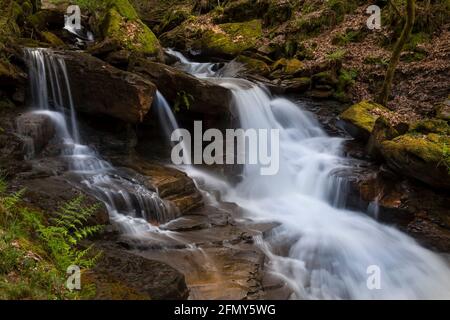The stream that supplies Melicourt Falls with water in Resolven in the Neath Valley, South Wales, UK Stock Photo