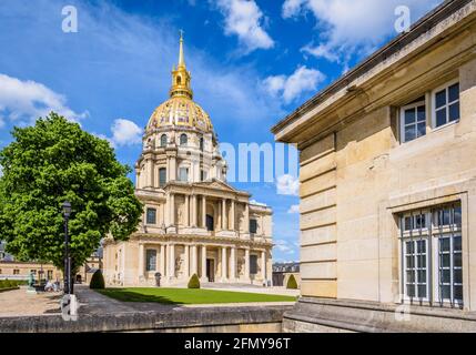 Facade of the Dome des Invalides in Paris, France, a former church with a golden cupola which houses the tomb of Napoleon Bonaparte, and a guardroom. Stock Photo