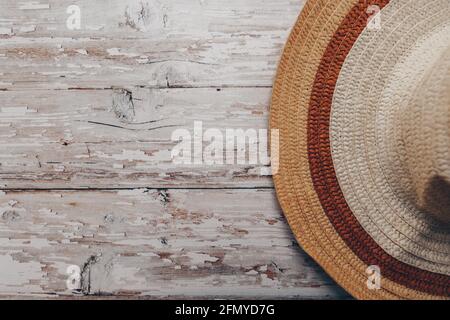straw brown-beige summer hat on wooden background  Stock Photo