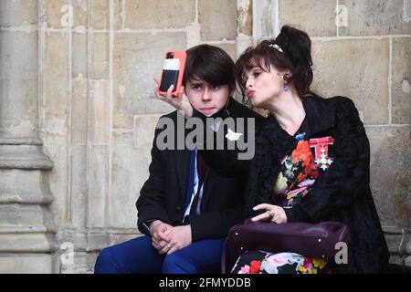 Helena Bonham-Carter, who is a descendant of healthcare pioneer Florence Nightingale, and her son Billy Raymond Burton, outside Westminster Abbey, where Bonham-Carter is giving a reading during the Abbey's annual service for the Florence Nightingale Foundation, to mark nurses' contribution to the community. Picture date: Wednesday May 12, 2021. Stock Photo