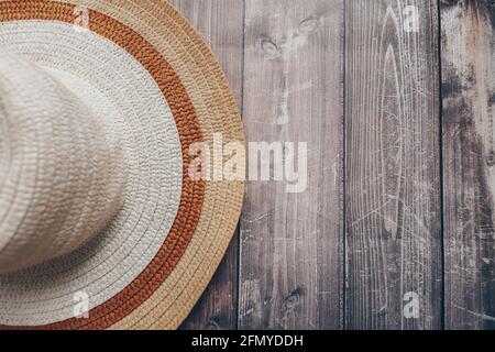 straw brown-beige summer hat on wooden background  Stock Photo