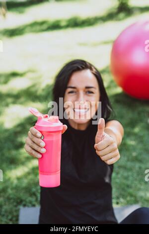 Young Fitness Women With Water Bottles Focus On The Bottles Stock