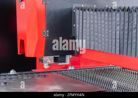 Automatic cnc laser cutting machine working with sheet metal at exhibition Stock Photo