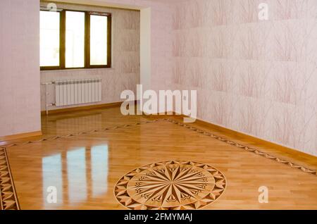 Azerbaijan Baku .13.11.2020 . Parquet house . wooden parquet floor and white wall background - empty room , new flat . Empty room ready to move in ele Stock Photo