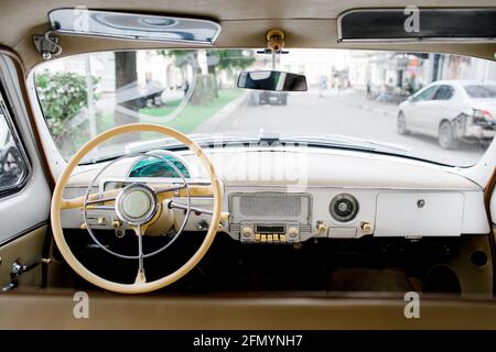 Driver's cockpit of a classic car. Old car interior  Stock Photo