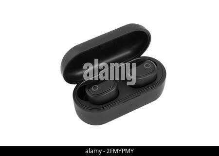 Side view of black wireless earbuds headphones in charge case. Black earpieces isolated on white background. Stock Photo