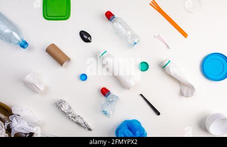 Set of plastic waste on a white background, flat lay. Concept collection of recycling plastic waste recycling. Banner Stock Photo