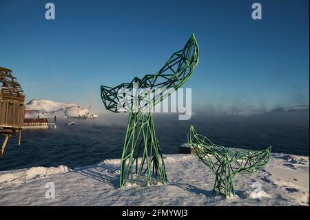 Teriberka, Murmansk region Russia - 01.19 2020: Whale metallic tail statue on the pictoresque village Stock Photo