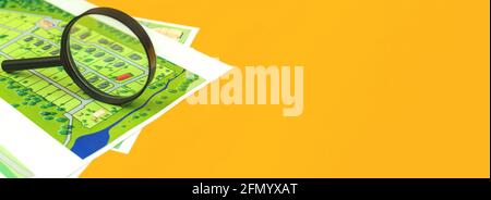 Banner real estate maps, searching for a land for house construction, official documents on the office desk with magnifying glass, copy space Stock Photo