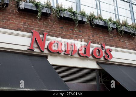 Red Logo Shop Sign Brand Nandos Restaurant Takeaway Stock Photo