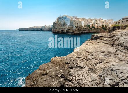 Old Town on the Cliff at the sea cost. Famous touristic destination Polignano a Mare in South Italy. Beautiful seascape panorama. Stock Photo