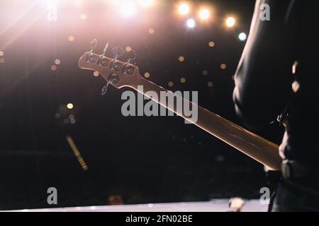 The artist plays the guitar. Rock band at a concert Stock Photo